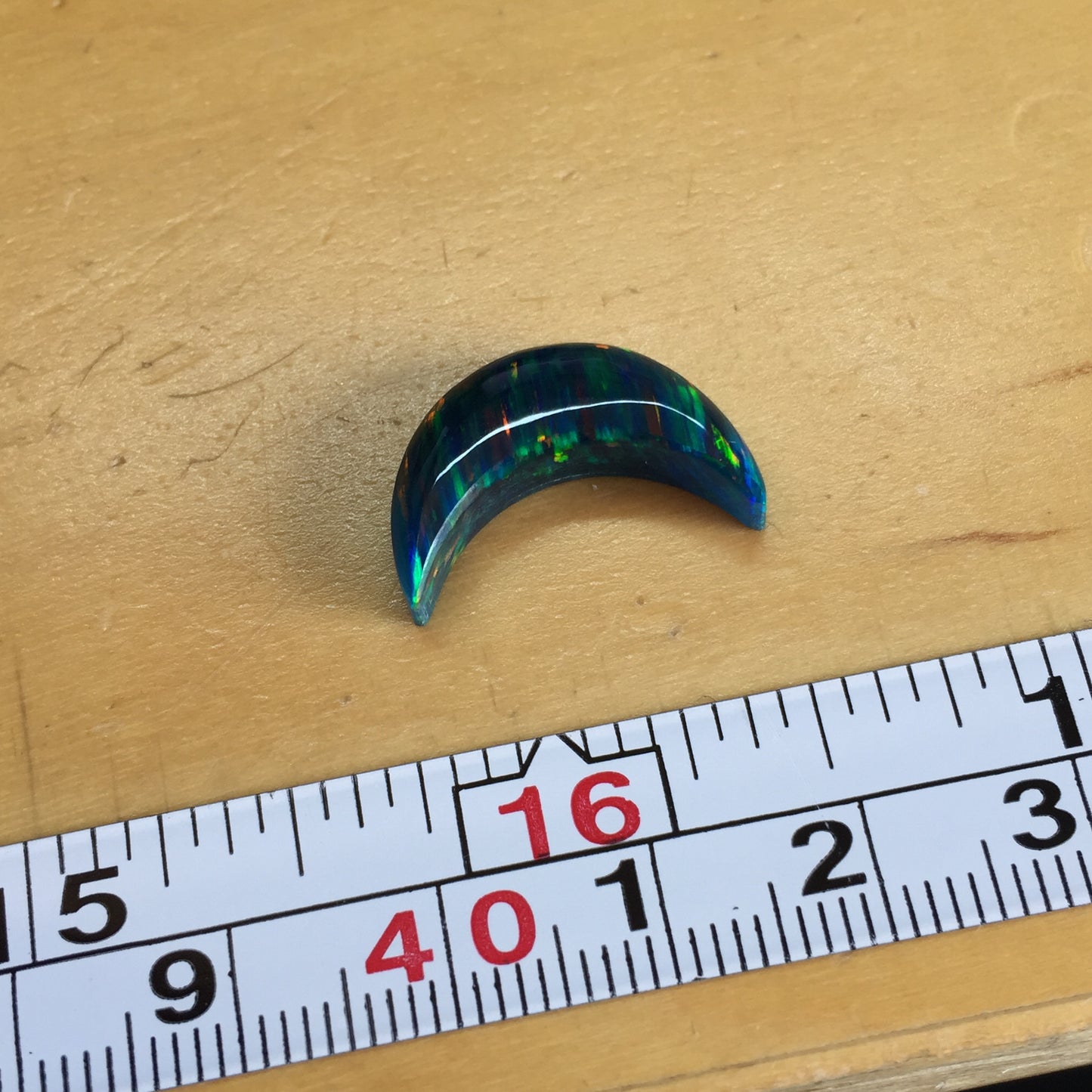 Aura opal crescent cabochon
