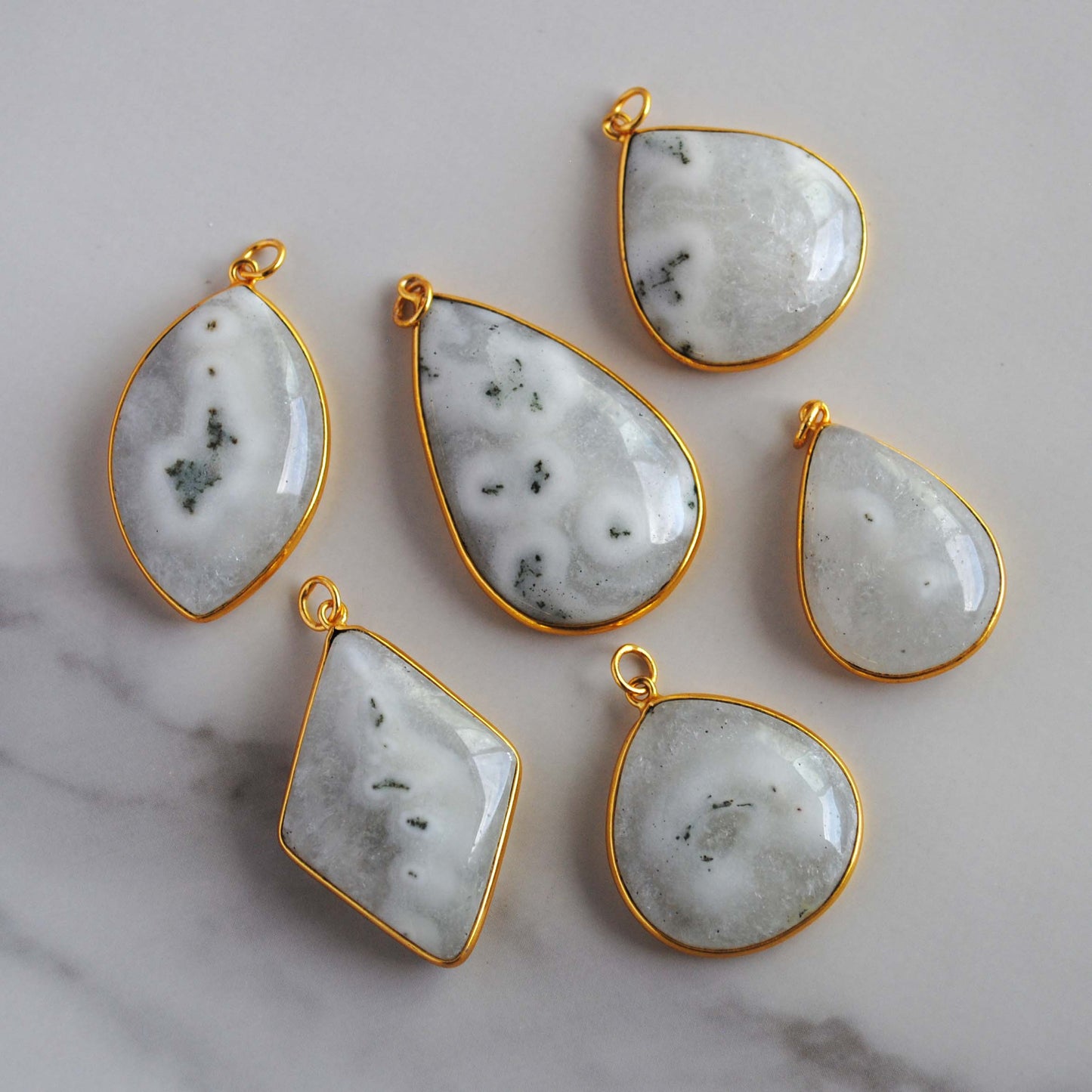 Solar Quartz gold plated pendants