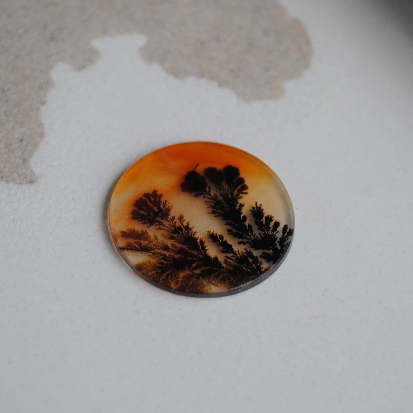 Dendritic agate stone on a white background