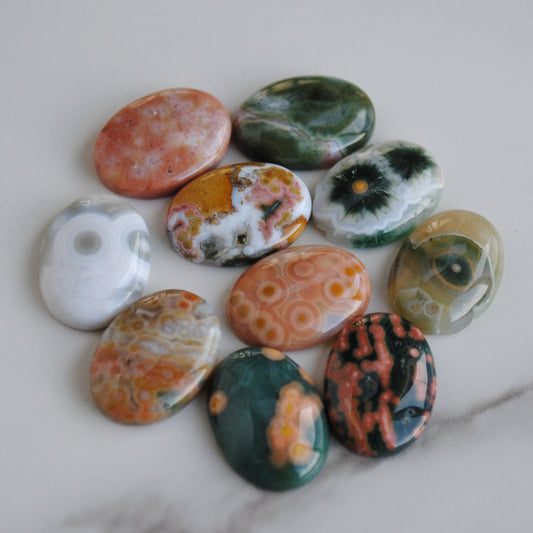 Colorful patterned stones on a marble surface