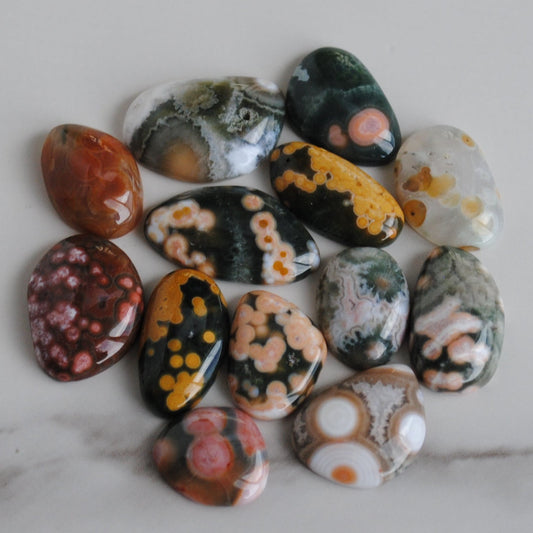 Collection of multicolored stones on a marble surface