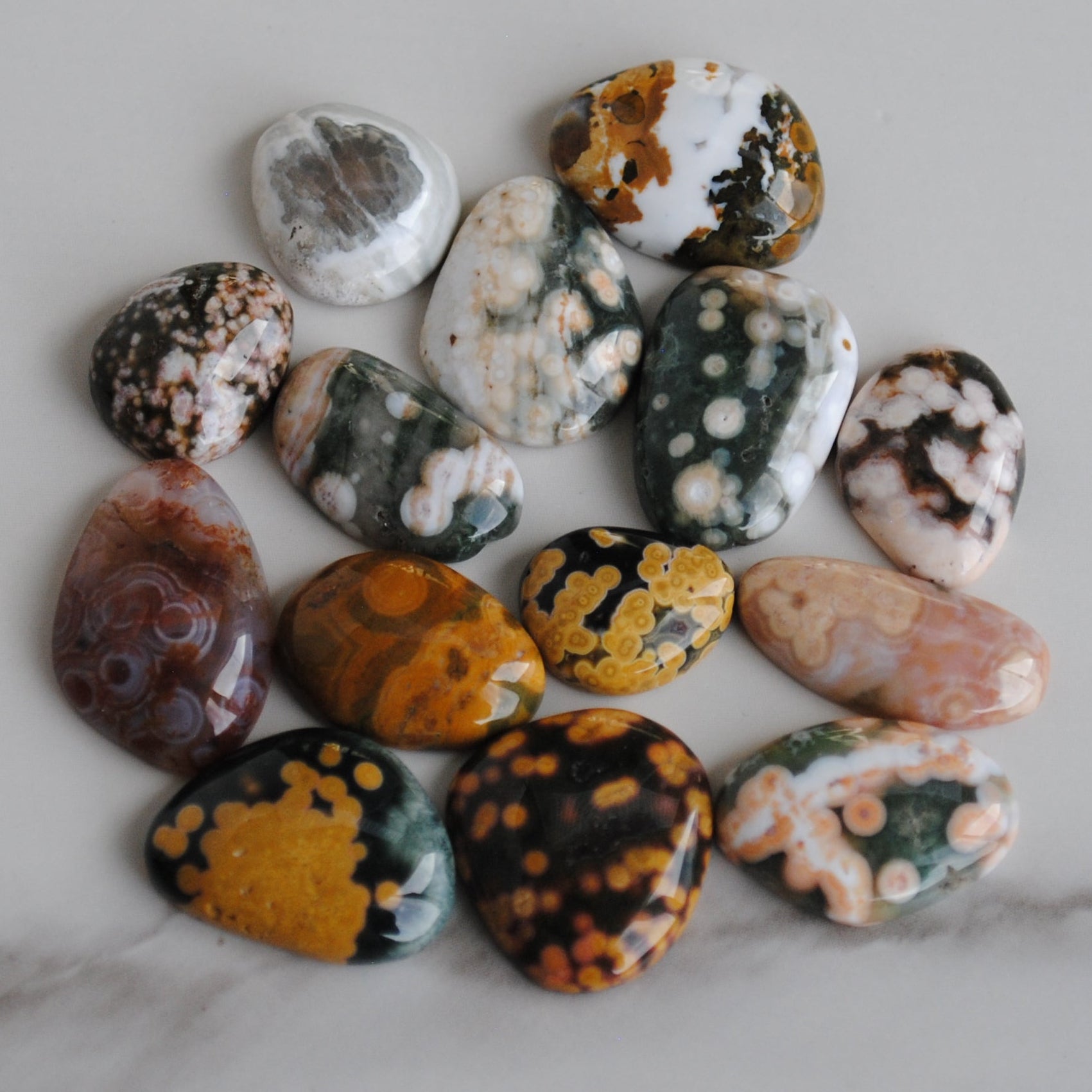 Collection of multicolored stones on a marble surface