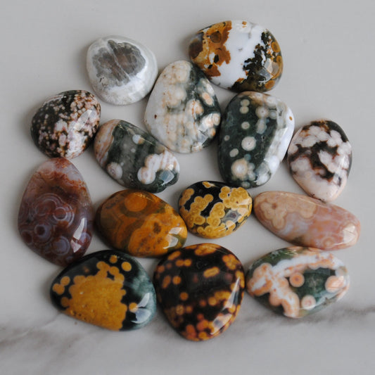 Collection of multicolored stones on a marble surface
