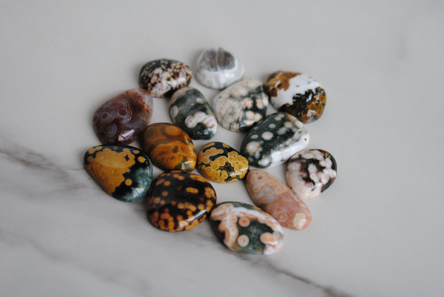 Collection of multicolored stones on a marble surface