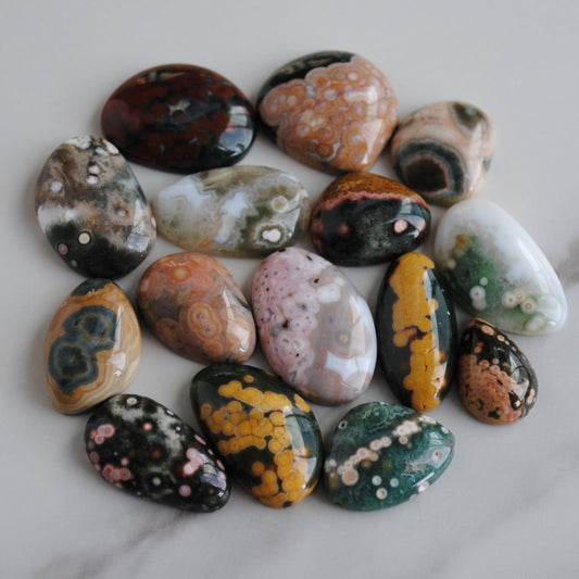 Collection of multicolored stones on a marble surface