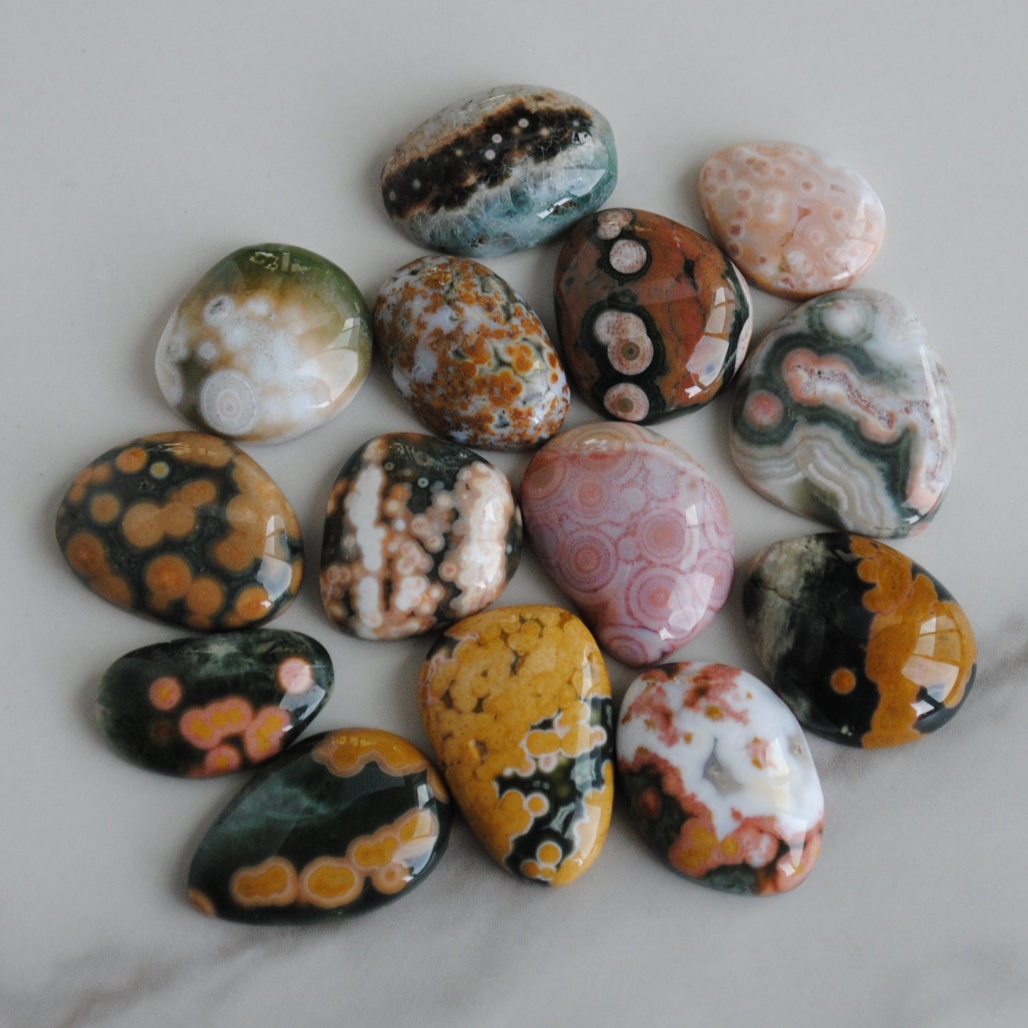 Colorful marbled stones on a marble surface