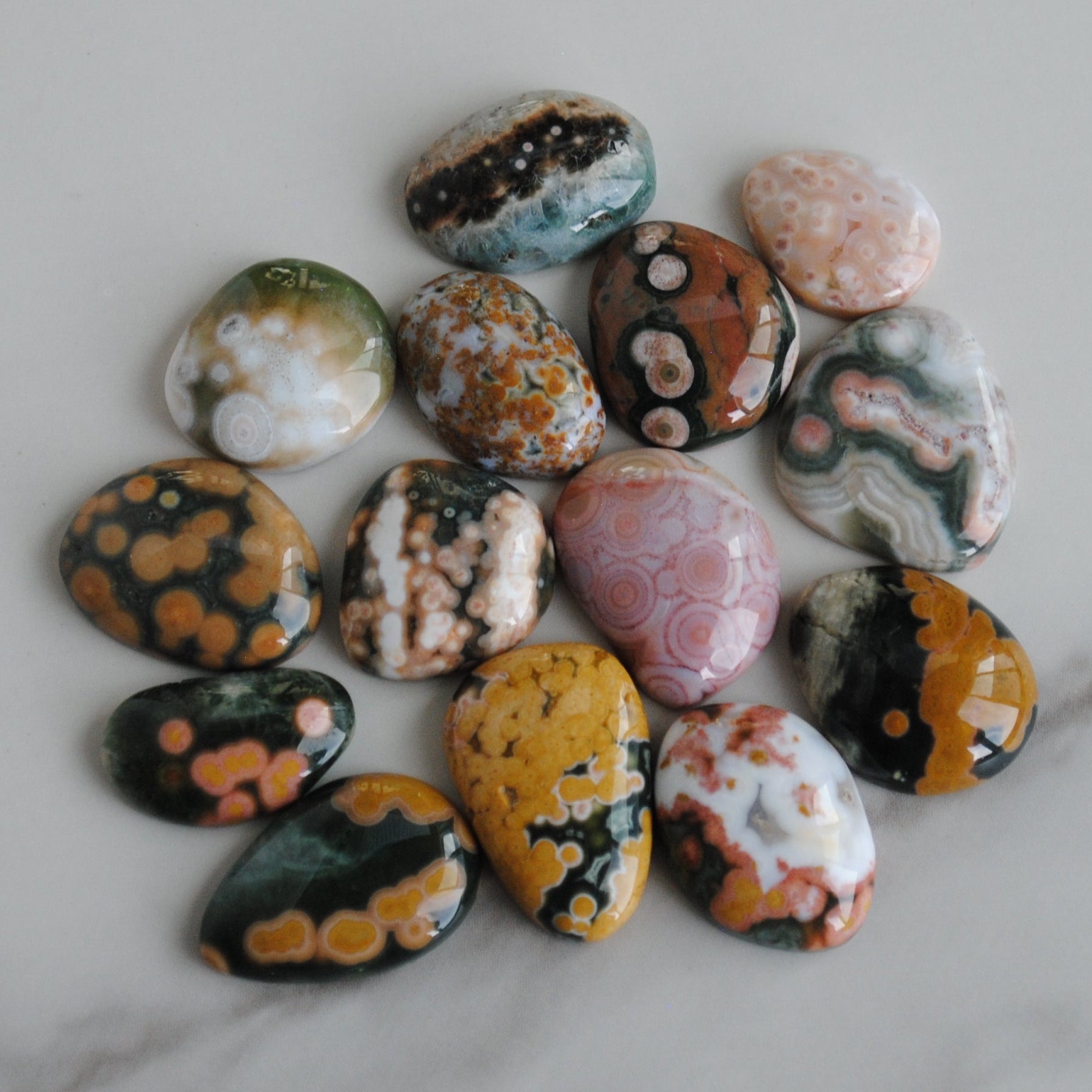 Colorful marbled stones on a marble surface