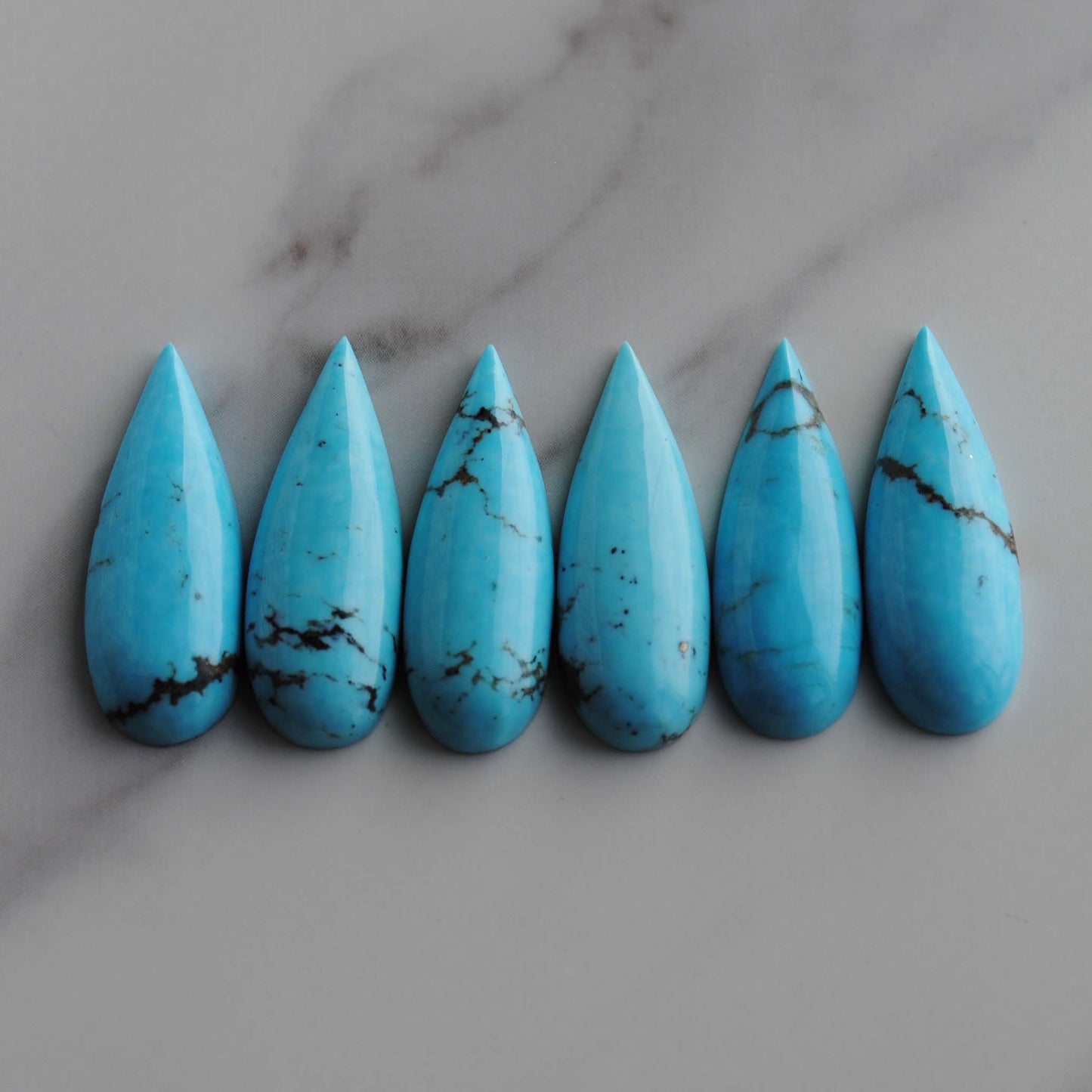 Kingman turquoise long drop/pear cabochons
