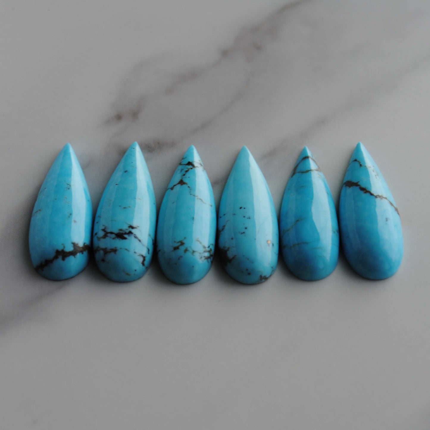 Kingman turquoise long drop/pear cabochons