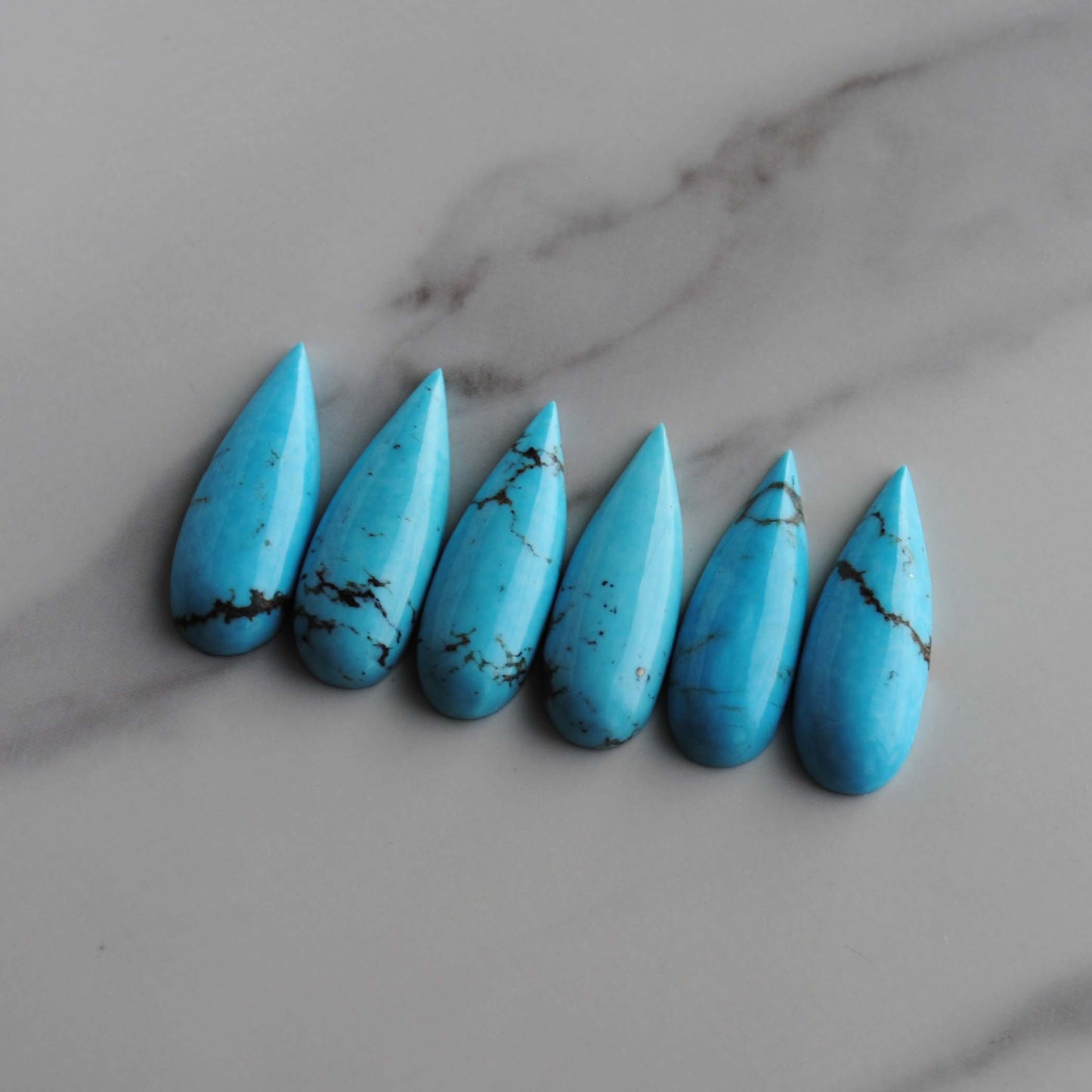 Kingman turquoise long drop/pear cabochons