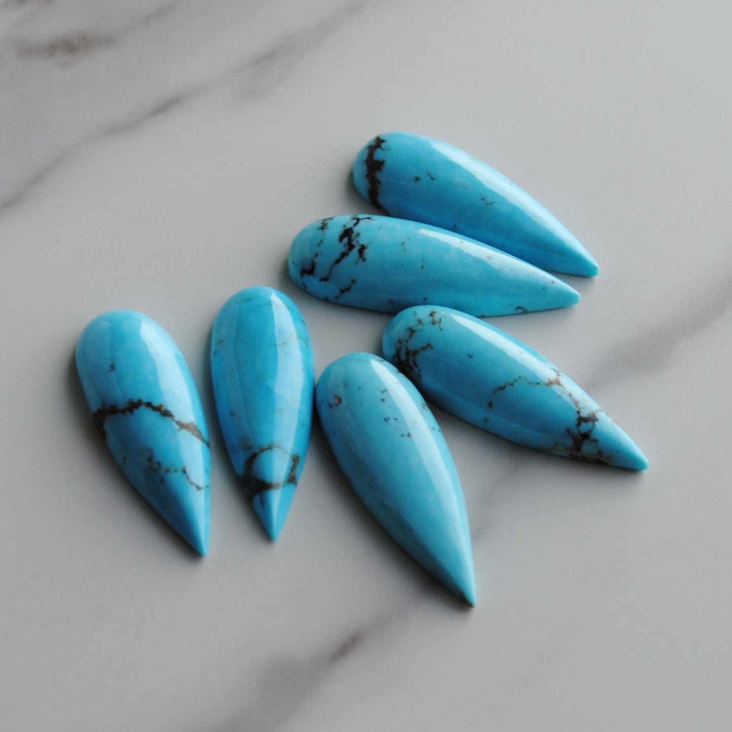 Kingman turquoise long drop/pear cabochons