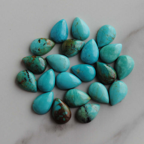 Kingman turquoise cabochons 7x10mm drops/pears (lot aa)