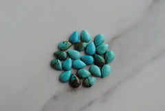 Kingman turquoise cabochons 7x10mm drops/pears (lot aa)