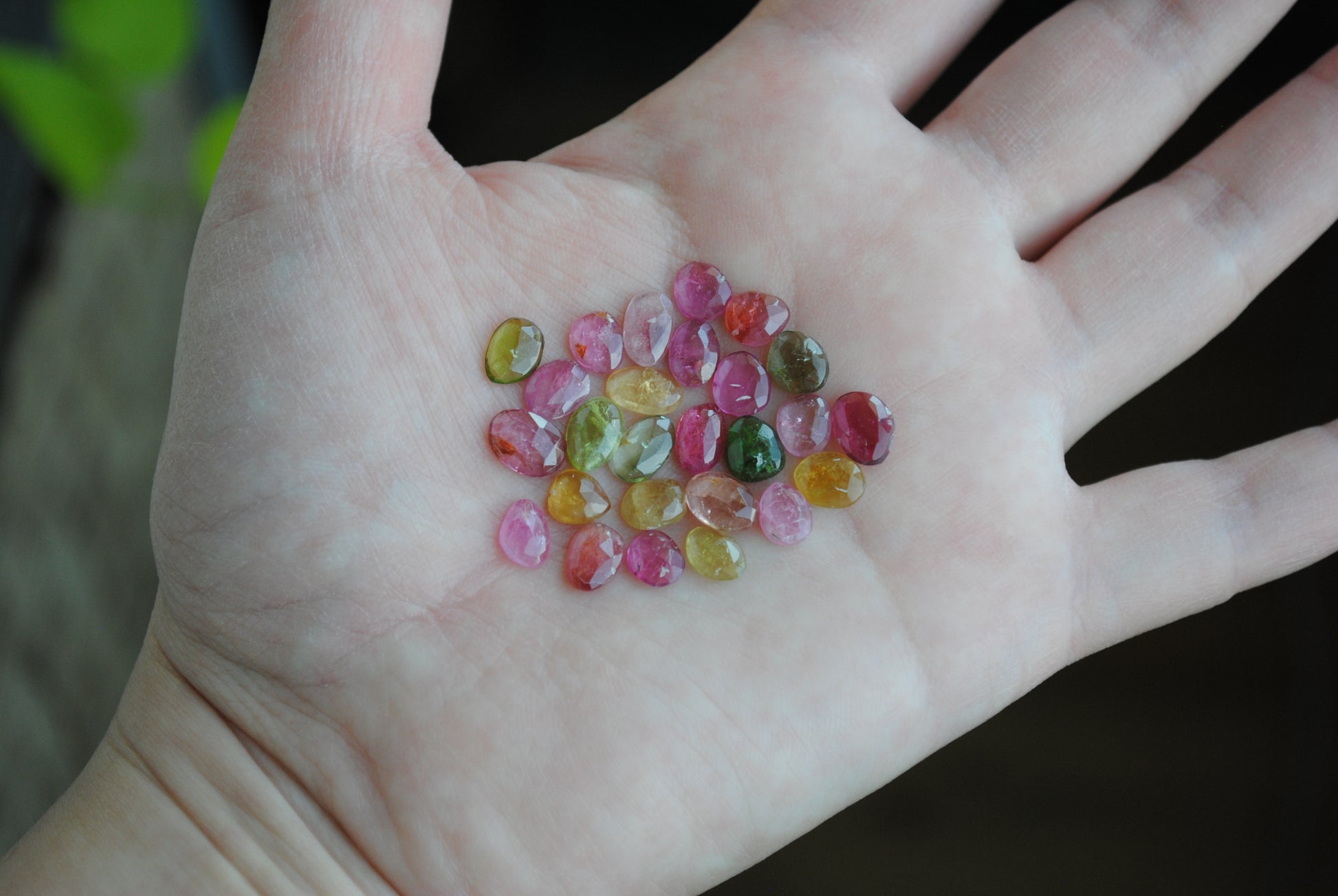 Tourmaline rose cut cabochons on palm of hand