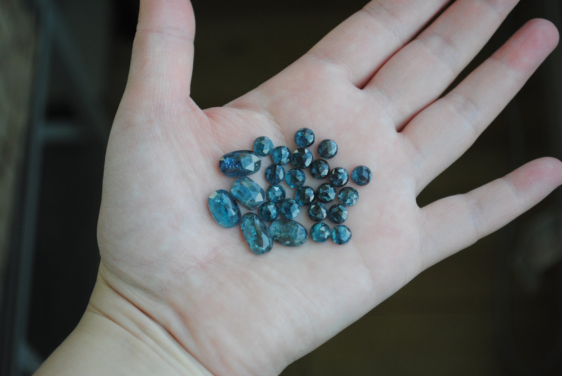 Kyanite rose cut cabochons on palm of hand