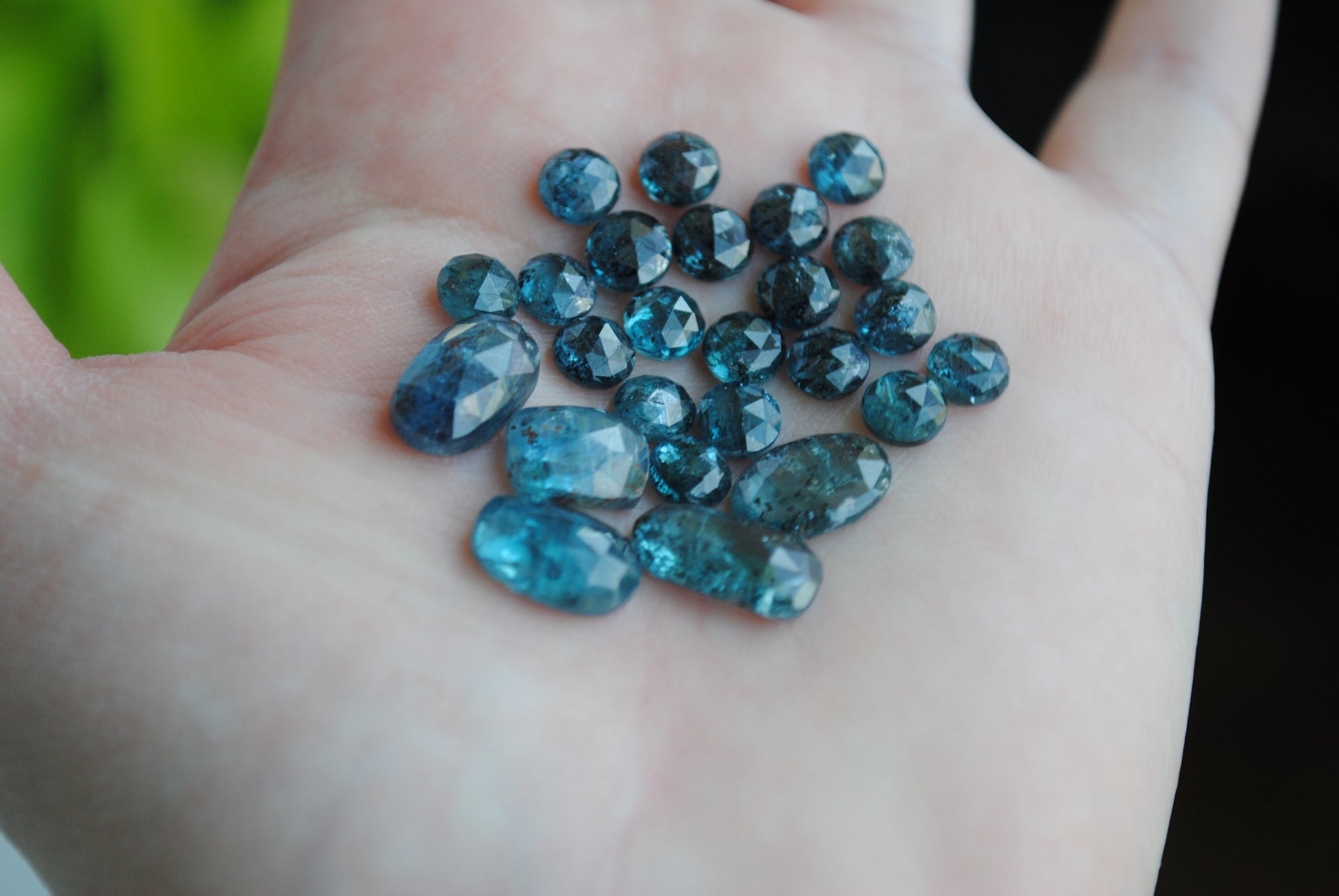 Kyanite rose cut cabochons on palm of hand
