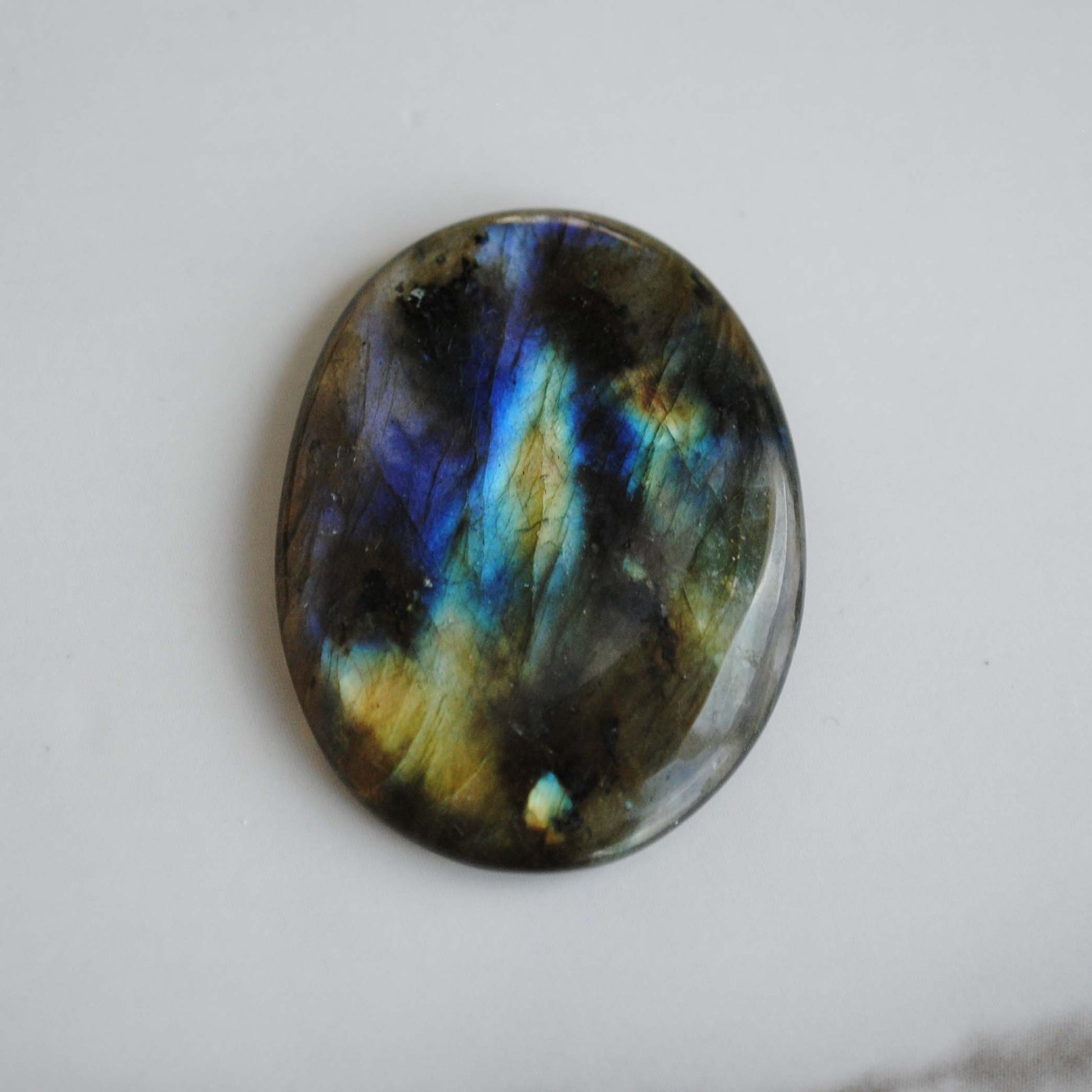 Labradorite stone on light background