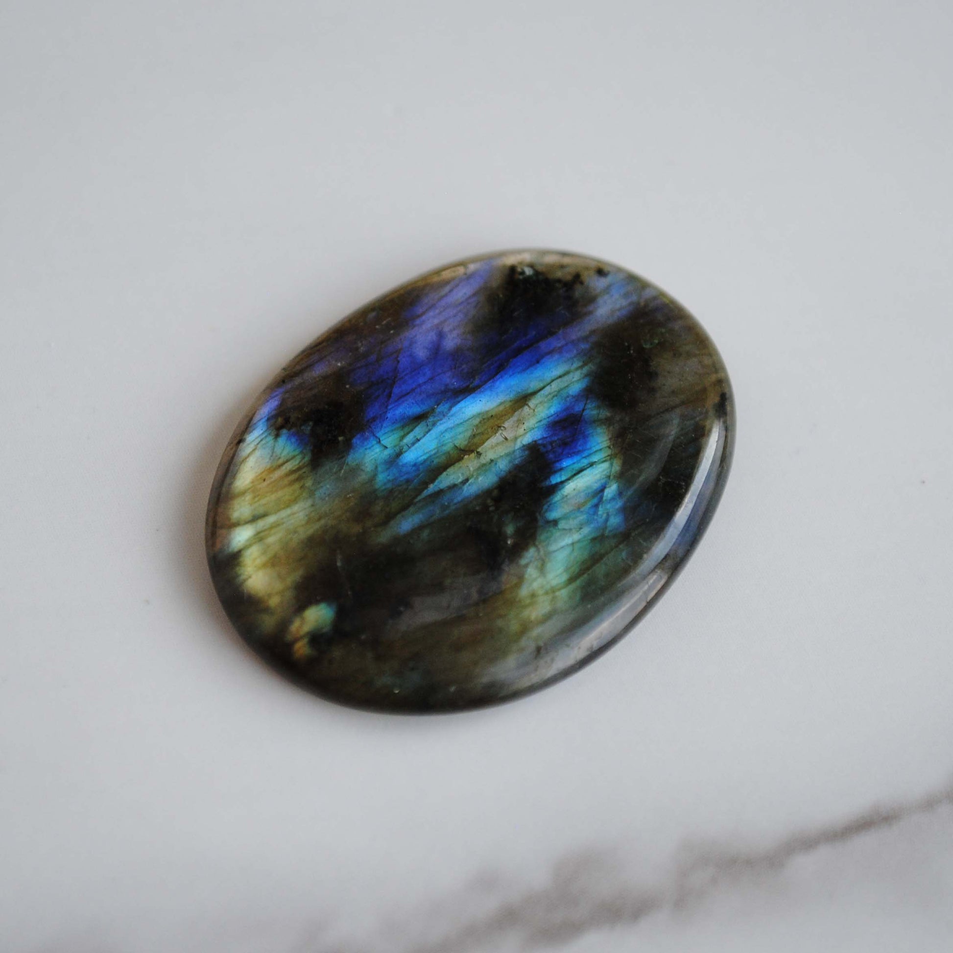 Labradorite stone on light background