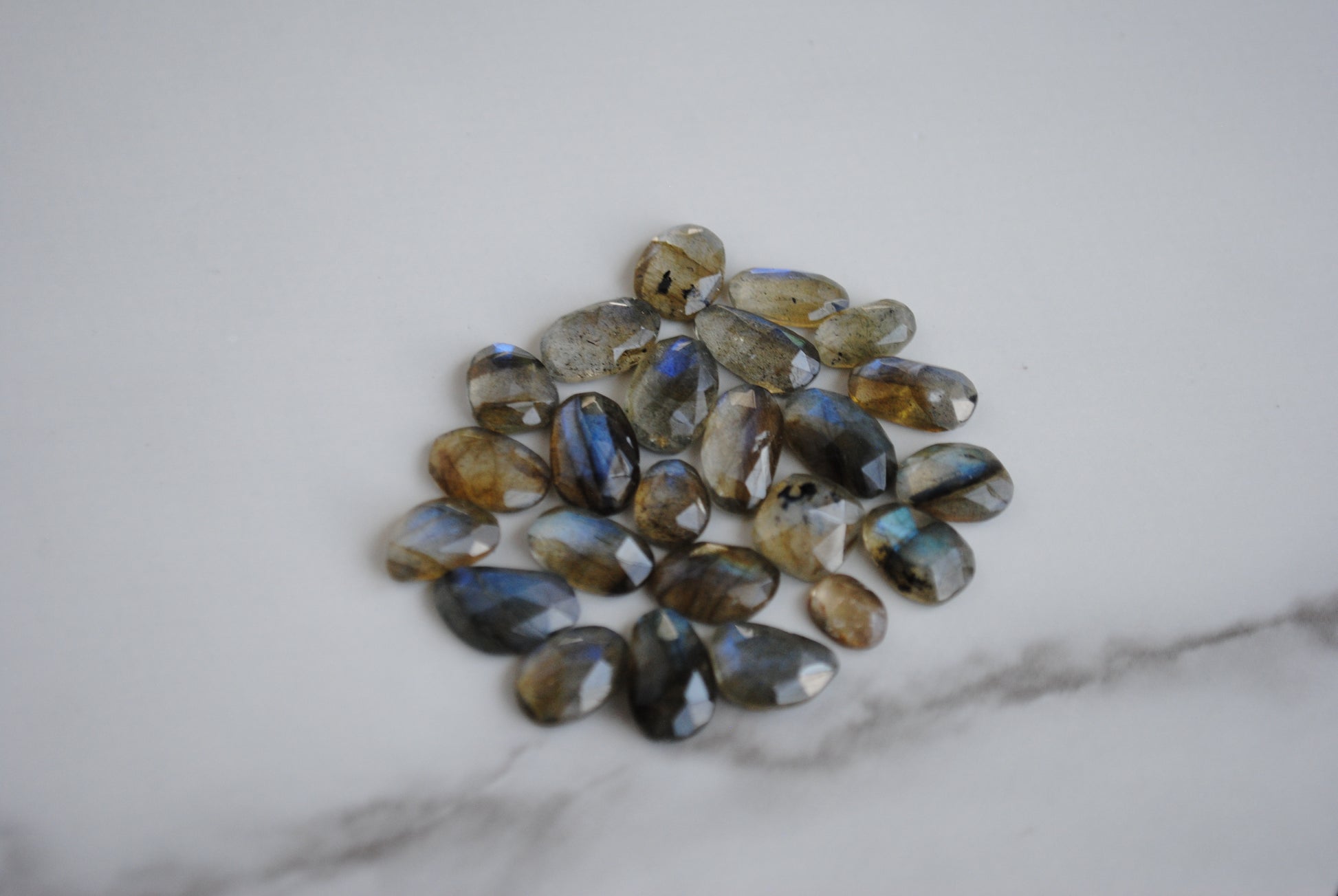 Labradorite rose cut cabochons on light background