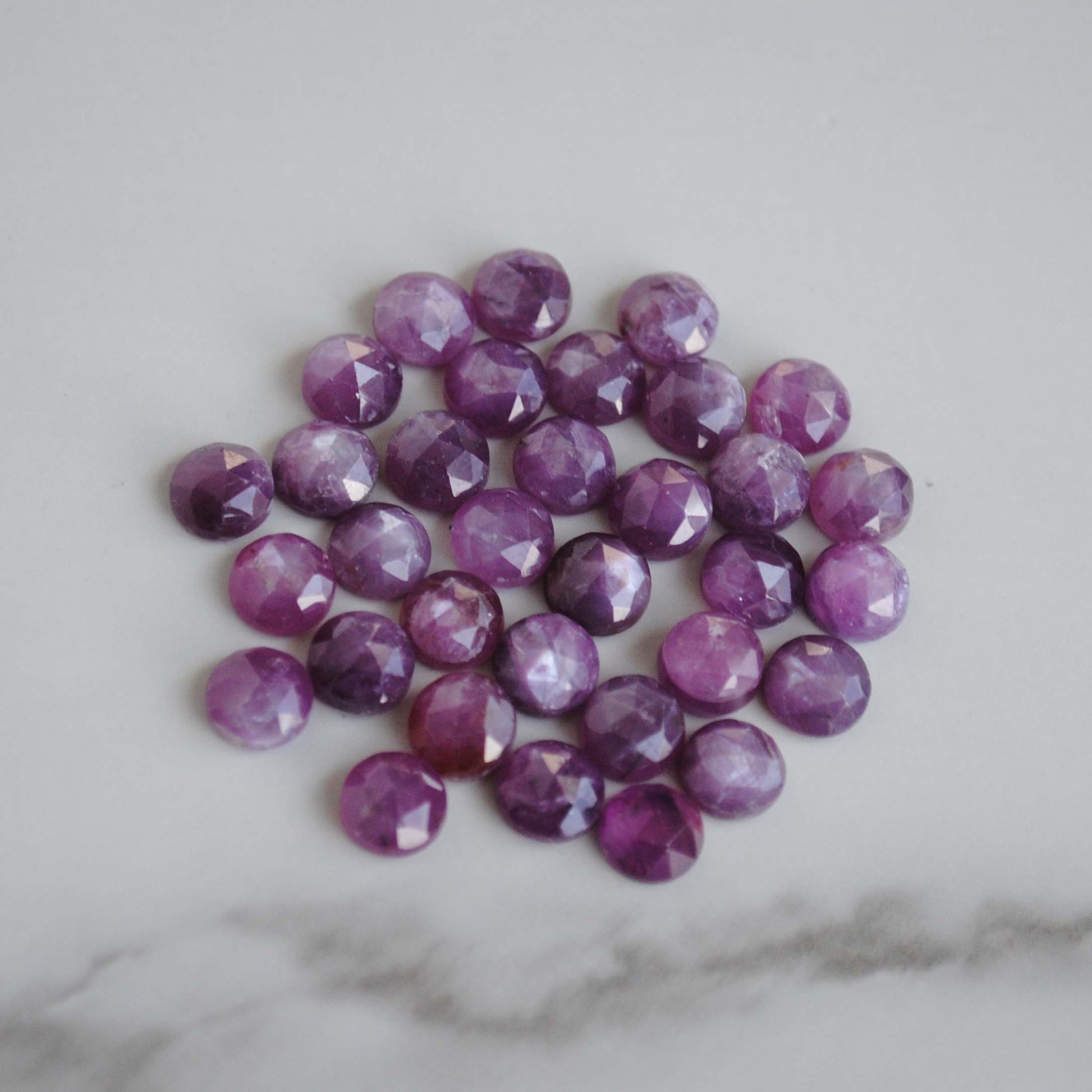 Rose cut sapphires on light background 
