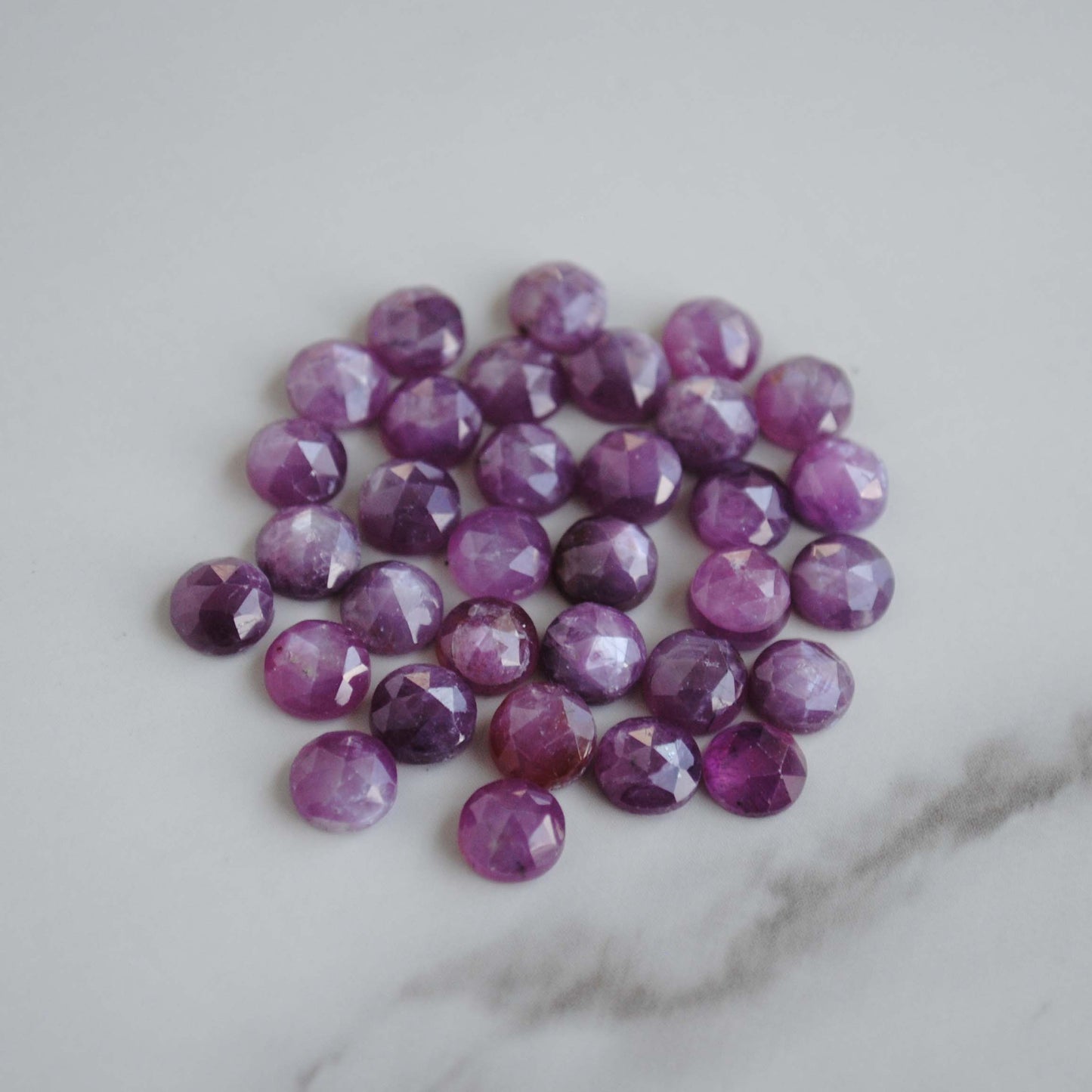 Rose cut sapphires on light background 
