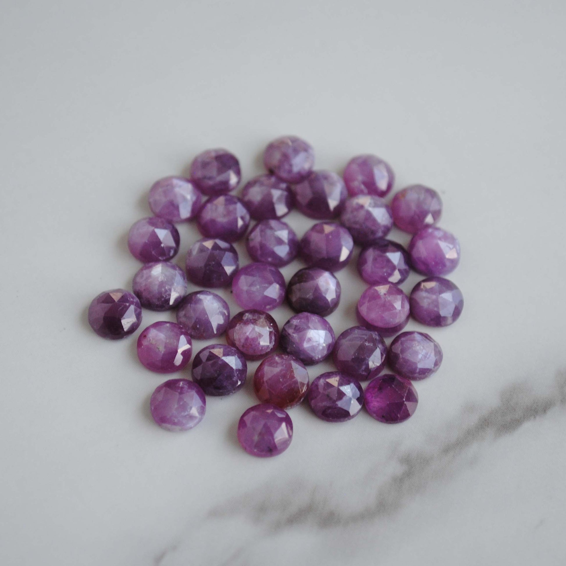 Rose cut sapphires on light background 