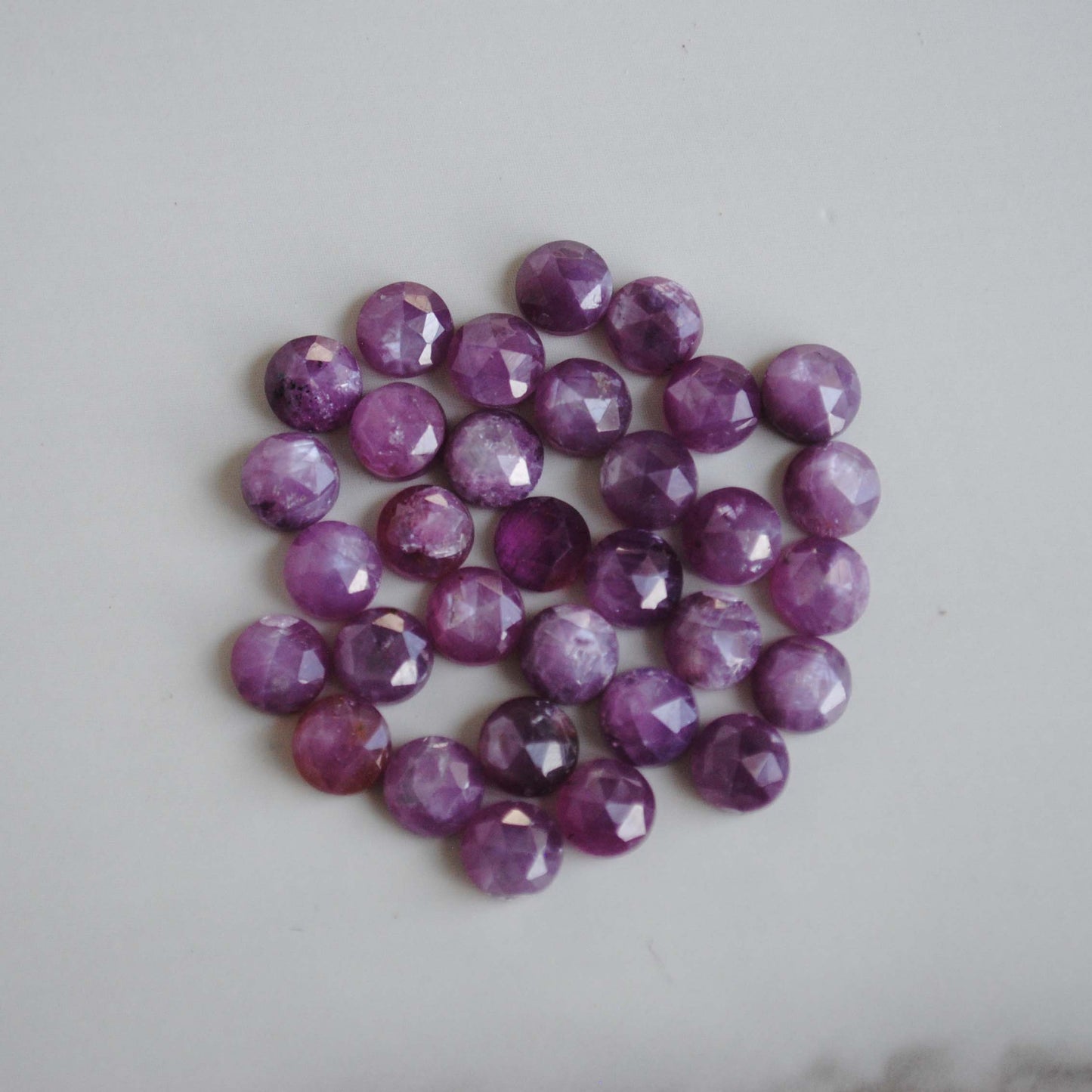 Rose cut sapphires on light background 