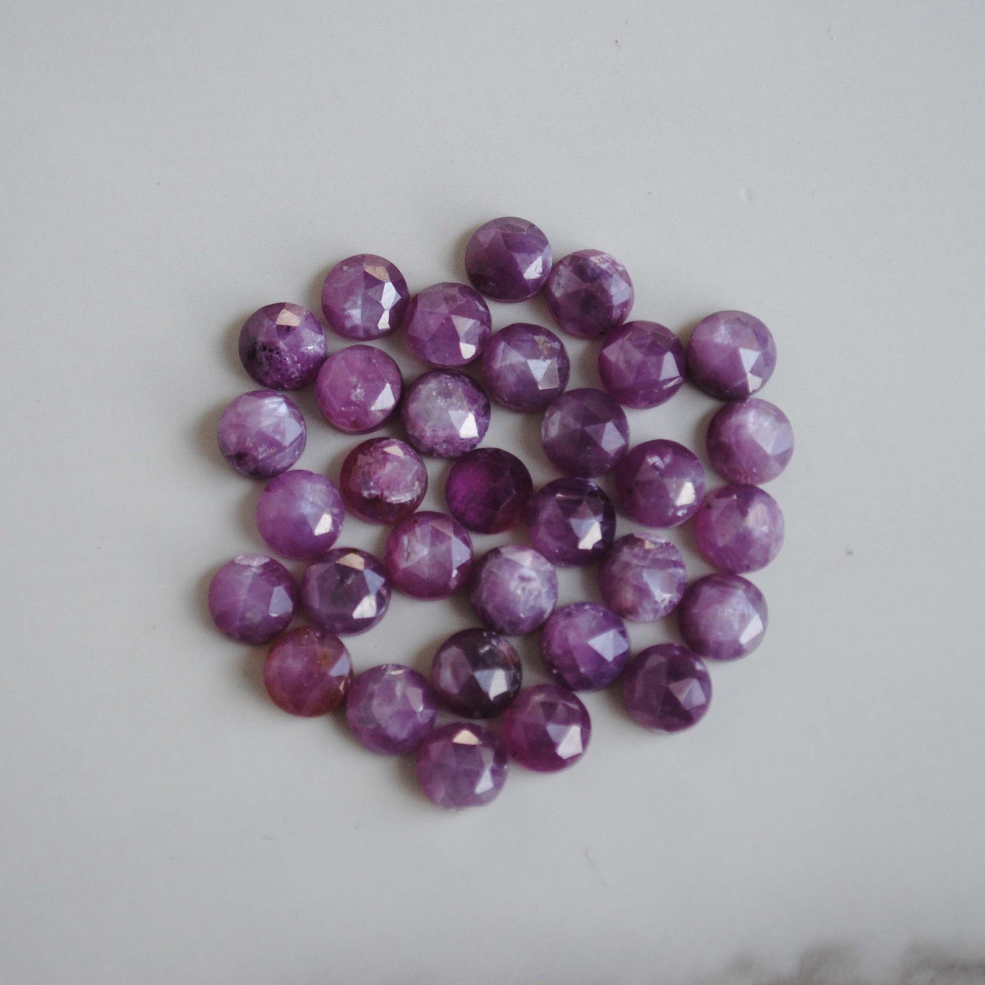 Rose cut sapphires on light background 