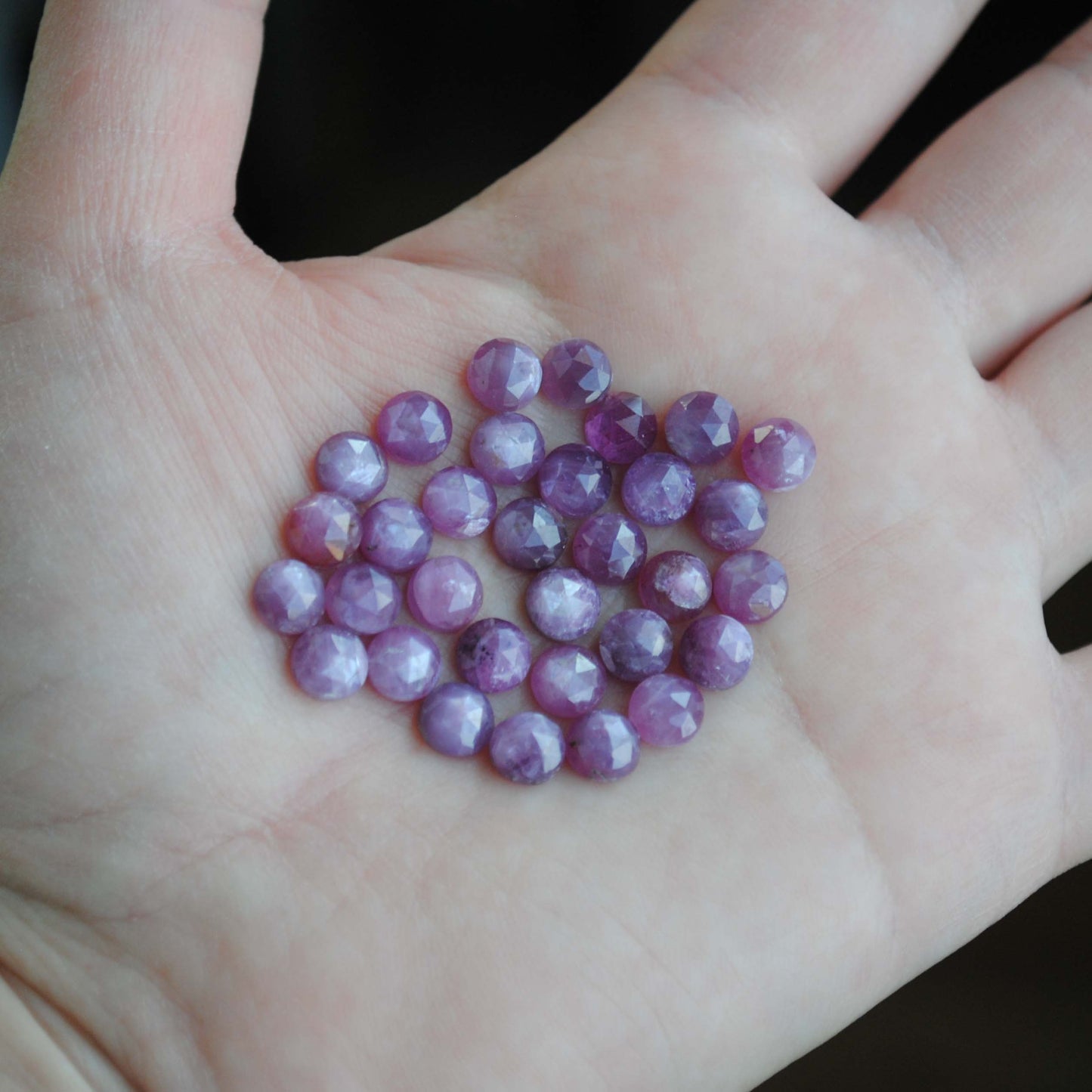 Rose cut sapphires on palm of hand