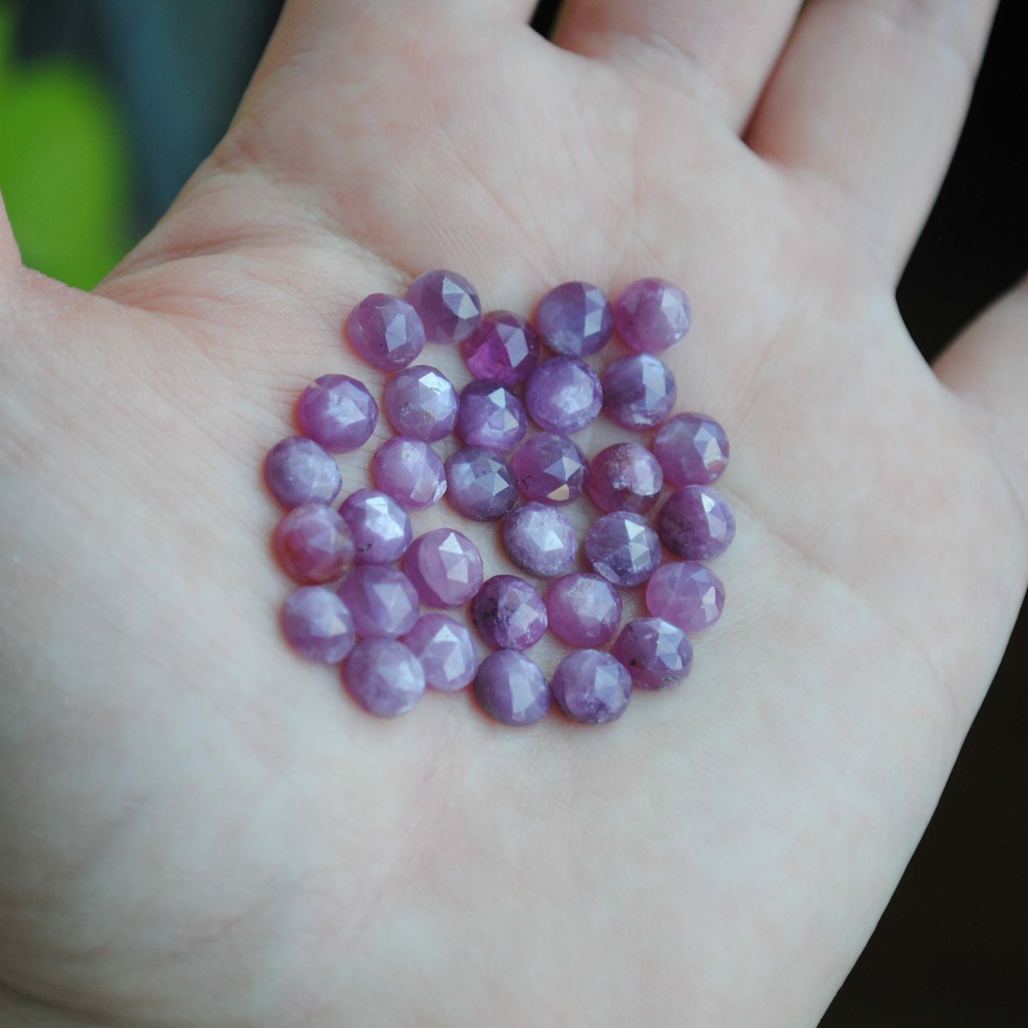 Rose cut sapphires on palm of hand