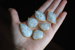Solar Quartz gold plated pendants