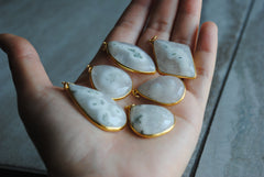 Solar Quartz gold plated pendants